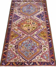 Lot#1113, PERSIAN SOUMAK CARPET, 6' 10" X 4' 1" Stylized birds within white surrounds and medallions of yellows and blues.