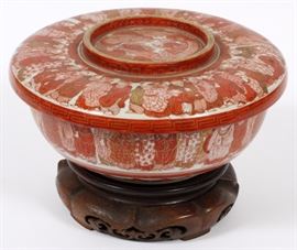 Lot#1117, JAPANESE IRON-RED PORCELAIN COVERED BOWL, 19TH C., DIA 9" A round bowl and cover, gilt and iron-red, individualized courtiers about the exterior of the bowl and rim of lid; the basin with a dragon winding through kumo, a key band and sayagata enclose a figure with a signed scroll.  Measures overall H.4 1/4", Dia.9". From the collection of Mrs. G. G. Scranton, international traveler from the late 1800's to the mid twentieth century. Friend and patron of Mrs. Dagny Carter, a notable scholar, influenced this collection.