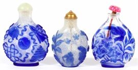 Lot#1124, CHINESE WHITE GLASS SNUFF BOTTLES, THREE..Each white glass snuff bottle features blue overlay.  Two are H 2.5" and the third is H 2.25".