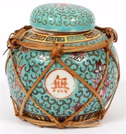 Lot#1140, CHINESE PORCELAIN GINGER JAR, H 4 1/2"A round porcelain ginger jar, turquoise ground with alternating character reserves and blossoming flowers.  Measures H.4 1/2", Dia.4 1/2".  With original cork top and basket. From the collection of Mrs. G. G. Scranton, international traveler from the late 1800's to the mid twentieth century. Friend and patron of Mrs. Dagny Carter, a notable scholar, influenced this collection.