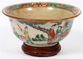 Lot#1142, CHINESE PAINTED PORCELAIN BOWL, DIA 10"A round bowl with crackle glaze, painted about the exterior with figural scenes and a leafy green and red rim.  Marked at the underside illegibly.  Measures approximately H.4 1/4", Dia.10". From the collection of Mrs. G. G. Scranton, international traveler from the late 1800's to the mid twentieth century. Friend and patron of Mrs. Dagny Carter, a notable scholar, influenced this collection.