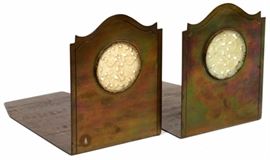 Lot#1150, POTTER STUDIO WHITE JADE AND BRASS BOOKENDS, C.1900, PAIR, H 5 1/8" Each set with a white jade openwork carved panel.  Measures overall H.5 1/8" x 7" x 4". Impressed with maker's mark and 'E103'.  Circa 1900. From the collection of Mrs. G. G. Scranton, international traveler from the late 1800's to the mid twentieth century. Friend and patron of Mrs. Dagny Carter, a notable scholar, influenced this collection.