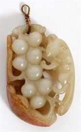 Lot#1151, CHINESE RUSSET AND WHITE JADE PENDANT, H 2 1/8"A russet and white jade pendant, relief carvings of a fox in a melon tree with leaves of the darker russet color, mounted with gold tone hook.  Measures H.2 1/8" x 1 1/2". From the collection of Mrs. G. G. Scranton, international traveler from the late 1800's to the mid twentieth century. Friend and patron of Mrs. Dagny Carter, a notable scholar, influenced this collection.