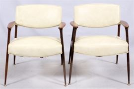 Lot#1182, MID-CENTURY MODERN ARM CHAIRS, PAIR.Having wood and metal frames with faux leather seat and back.