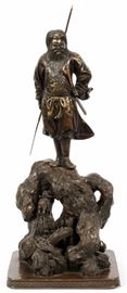 Lot#1216, JAPANESE BRONZE AND GOLD WARRIOR 19TH.C. H 24", W 10"Gold embellishments. Figure standing on rocky formation holding  spear and dagger. From an elegant home on Autumn Lane, Bloomfield Hills, Mi.