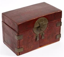 Lot#1366, CHINESE LACQUERED LEATHER BOX, LATE 19TH-EARLY 20TH C., H 7 1/2", W 11"A red-brown lacquer box, with raised landscapes and figures about all sides of the box; hinged opening reveals two doors to drawer storage.  Measures overall H.7 1/2" x 11" x 6 1/2". From the collection of Mrs. G. G. Scranton, international traveler from the late 1800's to the mid twentieth century. Friend and patron of Mrs. Dagny Carter, a notable scholar, influenced this collection.