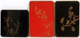 Lot#1380, JAPANESE LACQUER TRAYS, THREE, W 10"-14"Includes 1 footed tray with a few blossoms, W.10 3/4" x 10 3/4"; 1 black lacquered tray with pine branches, W.14 3/4" x 9 1/2"; together with 1 other red lacquer tray of the same size.  Three trays total. From the collection of Mrs. G. G. Scranton, international traveler from the late 1800's to the mid twentieth century. Friend and patron of Mrs. Dagny Carter, a notable scholar, influenced this collection.