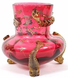 Lot#2342, CRANBERRY GLASS VASE, 1870, H 7 1/2" Three dolphin feet, in full relief. Very unusual form and decoration, possibly Moser. From a prominent Bloomfield Hills collector.