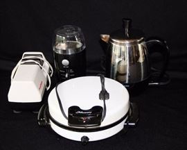 Four Kitchen Appliances: Munsey waffle iron, Farberware superfast six cup coffee pot, Hamilton Beach grinder, Chef's Choice Diamond Hone knife sharpener