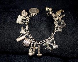 Sterling Silver Charm Bracelet: 16 charms; 45.4g