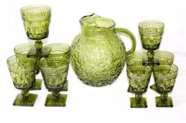 Eleven Piece Vintage Green Pressed Glassware: 9" Water Pitcher, five water goblets, five juice goblets; one water goblet has small chip