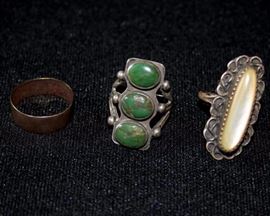Three Vintage Rings: Mother of pearl set in sterling silver ring, turquoise set in sterling silver ring, copper ring; sterling silver rings weigh 13.1g including stones