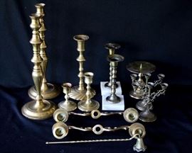 12 Piece Brass Collection: two 5"W x 13.5 H candlesticks, one 4.5" W x 9" H candlestick, two 3" W x 7.25" H candlesticks w/ marble bases, two 2.5" W x 5" H candleabras, one 3" W x 5" H candlestick, one 2.75" W  x 3.5 H candlestick, one 4.25" W x 4.5" H candlestick, 10.5" W x 2" H four candle holder (w/o center attachment), one candle snuffer
