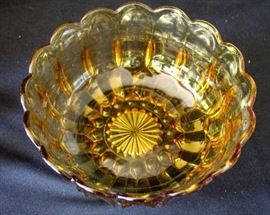 Six Pieces of Vintage Amber Glass: 9" W x 4" H bowl, 6" W x 11" H vase, two sets of 1.5" W x 2.75" H salt & pepper shakers