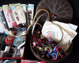 Assorted Sewing & Embroidery Products: Eighteen assorted unused zippers (eleven in original packaging), needles, thread, thimbles, straight pins, tape, trim, embroidery hoops, etc.)