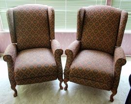 Two Upholstered Reclining Armchairs w/ Wood Feet: Good condition commensurate with age, some tearing of stitching on lower corners. Arm rest & head rest covers included, but well worn. 29" W x 25" D x 40" H