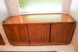 Three Door Wood Buffet Cabinet: In excellent condition and has adjustable shelves and three drawers. 62" L x 17.5" D x 28.5" H