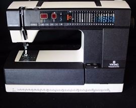 Husqvarna Viking 940 Sewing Machine: In working condition, and includes owner's manual, pedal, cord, case, and accessories.