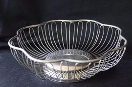 Four Assorted Metal Serving Holders: Two 10" bread baskets, one 11.75" L x 9" W Corningware dish holder, one 9" L x 6.5" W Corningware dish holder