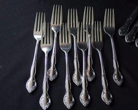 Ekco Stainless Steel Flatware: Set includes thirteen knives, nine dinner forks, six tea spoons, six soup spoons, one serving spoon, and three iced tea spoons. Made in Korea