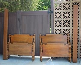 Antique / Vintage Bedroom Set: 3 piece set includes: vanity dresser with bench; headboard, foot board, and rails; 4 drawer chest of drawers.  Vanity: 50" W, 20" D, 66" H (inc. mirror). Bench: 25.5" W, 14" D, 18" H. Headboard 57" W, 49.5" H. Footboard 57" W, 30" H. Chest of drawers: 34" W, 19.5" D, 48" H. Bed and dresser on wooden casters, extra casters for vanity included. Built by John since 1891. Set is in good condition, commensurate with age.