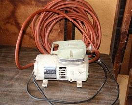 Airless Compressor: Penncraft model #6105. Hose is included, but cracked.