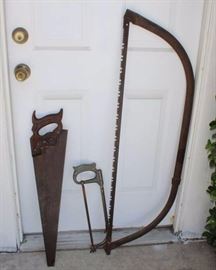 Three Saws: Large bow saw measures 45"L x 13.5" H. Vintage wood handled cross cut saw is dated 1928-1953, is made by Henry Disston & Sons of Philadelphia, PA, and measures 29" L x 6.25" H. Miteecut hacksaw has a 12" blade.