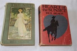 Two Rex Beach Hardcover Novels: The author was an early twentieth century American novelist. The two novels are The Art of the Sunset, (first edition copyright 1915), and The Net, (first edition copyright 1912). Books are in fair condition commensurate with age, with some discoloration of the pages, but with all pages and bindings intact.