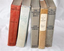 Five Gene Stratton-Porter Hardcover Novels: The American author wrote from the late 1800's through the early 1900's. The novels included in this lot are: The Keeper of the Bees (1925); A Girl of the Limberlost; The Magic Garden; The Harvester (1911); Laddie - a True Blue Story (1913). Titles with dates included are first edition publications. The books in this lot are in fair to poor condition.