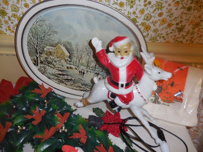 Vintage Blow Mold Light. Santa on White Horse. The horse back leg is rubber banded together. 