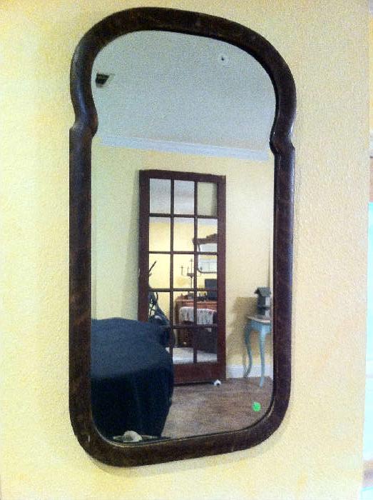 antique arched mirror which survived Hurricane Katrina.