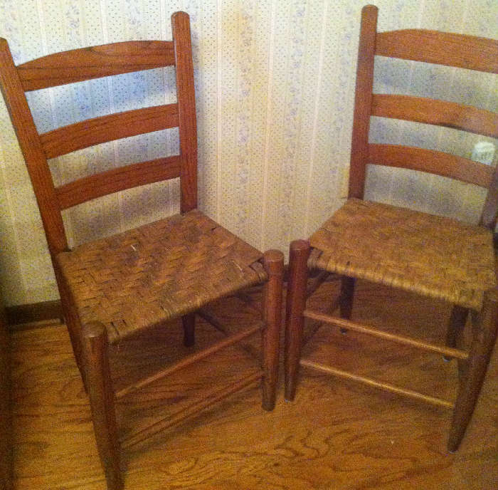 Two of four ladder back chairs