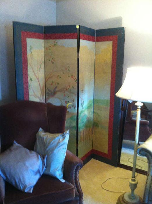 Painted screen, chocolate wing chair, floor lamp