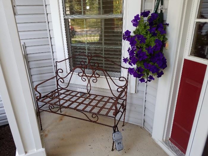 Bench and flowers are for sale