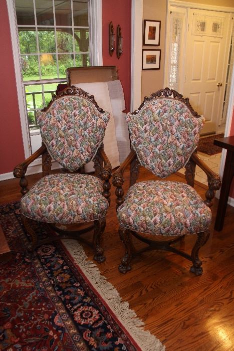 Pair of unique and beautiful antique carved chairs with new upholstery.  Lions heads on arms - comfortable and gorgeous!