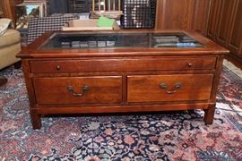 Bob Timberlake coffee table with glass top and display drawer to show off your valuables or memorabilia.  Two additional large drawers open from either side for storage.