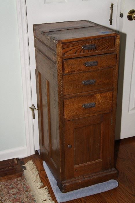 Antique oak cabinet with drawers and door
