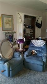 Pair of blue easy chairs with foot rests