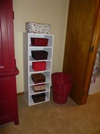 STORAGE SHELF WITH LOTS OF BASKETS THROUGH OUT THE HOUSE