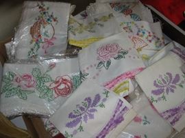 lots of hand embroidered pillow cases, some never used.