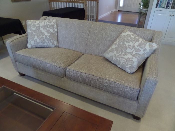 Couch and loveseat are more of a beige/tan color!  Very clean and in excellent condition.