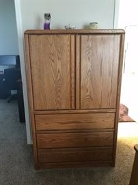 Armoire has a matching nightstand, dresser with mirror and King bed