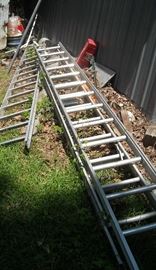 Large selection of wood and metal ladders
