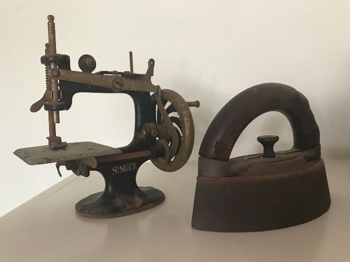 Antique toy sewing machine and antique cast iron sad iron