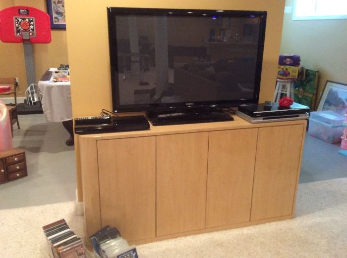 Signature flat screen television, DVD players, dvds, video games for Xbox and PlayStation 