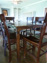 Kitchen table(counter/pub height) 6 chairs and built in leaf
