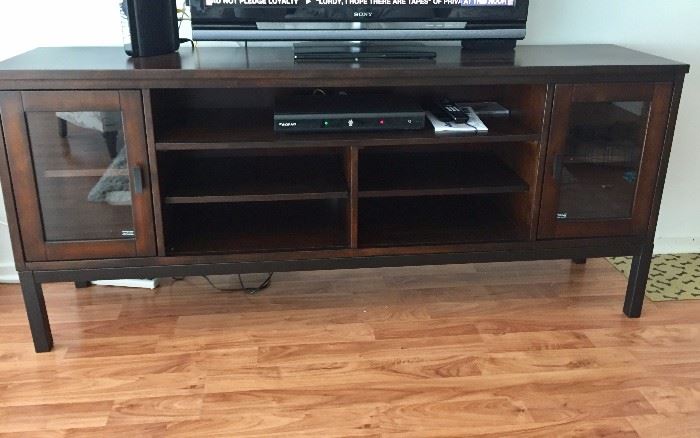 Modern style entertainment center. Less than one year old. Pristine.