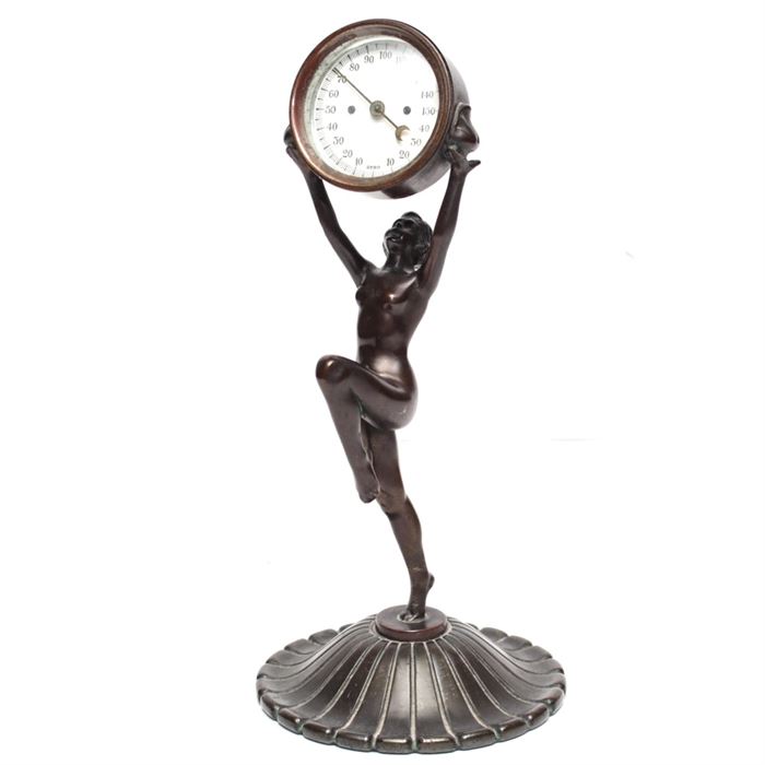 Rare Art Deco Nude Sculptural Promotional Thermometer: A rare Art Deco promotional sculptural thermometer, styled as a nude woman holding up a thermometer. This is believed to be an advertising promotional item given by the Pennsylvania Surety Corporation, Pittsburgh, US.A., date unknown. This dancing nymph has a bronze tone finish and is made of metal. She holds her head high as she lifts a round thermometer with white dial and Arabic numbers up for all to see. While she is caught mid-stride with one knee up, her other foot is barely perched upon a round, slightly domed floral base. The item is unsigned.