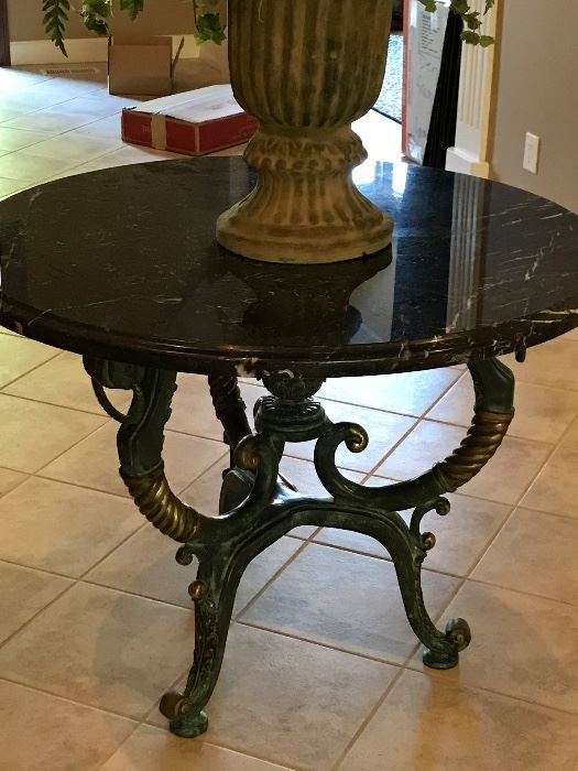 Cast bronze table with black marble top