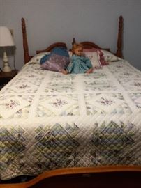 Bassett four poster bed, headboard, footboard, queen mattress set, Chatty Cathy sitting on bed